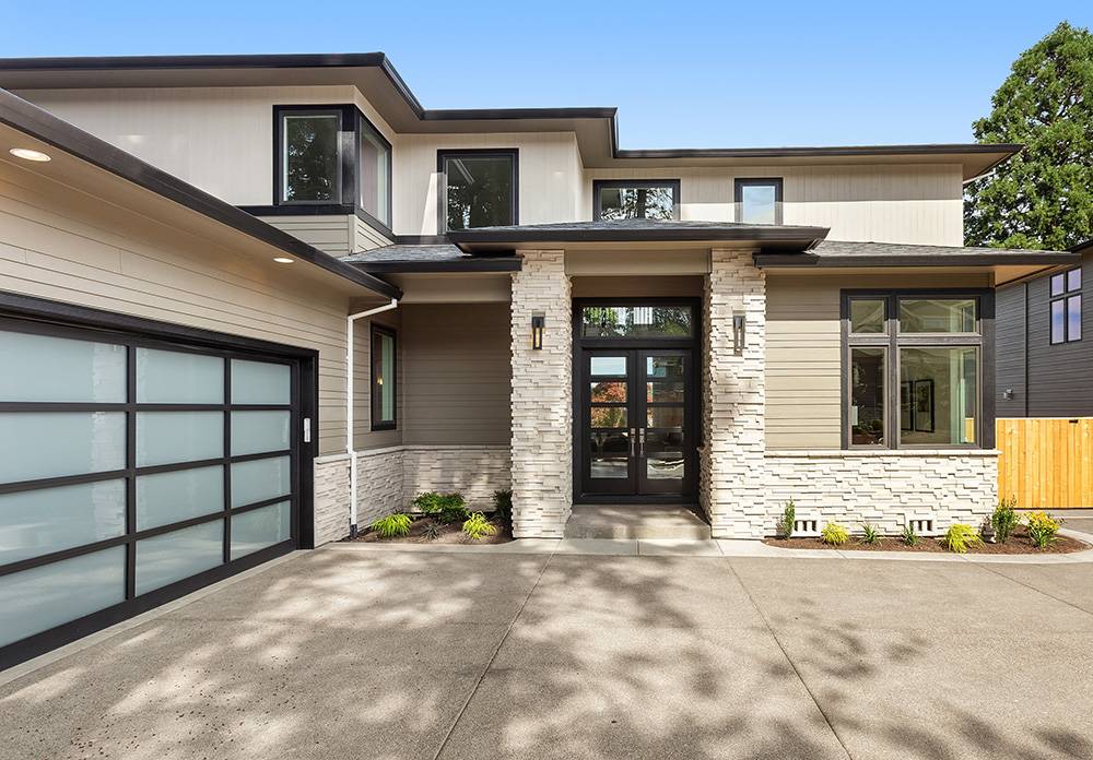 A modern home's exterior with sparkling clean windows after professional window cleaning, enhancing curb appeal.