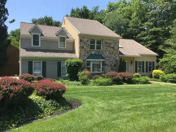 A home after professional roof washing, with a clean and bright roof that enhances curb appeal.